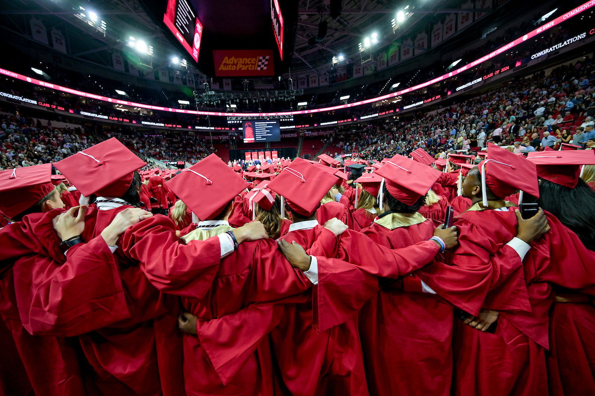 students in red cap & gowns