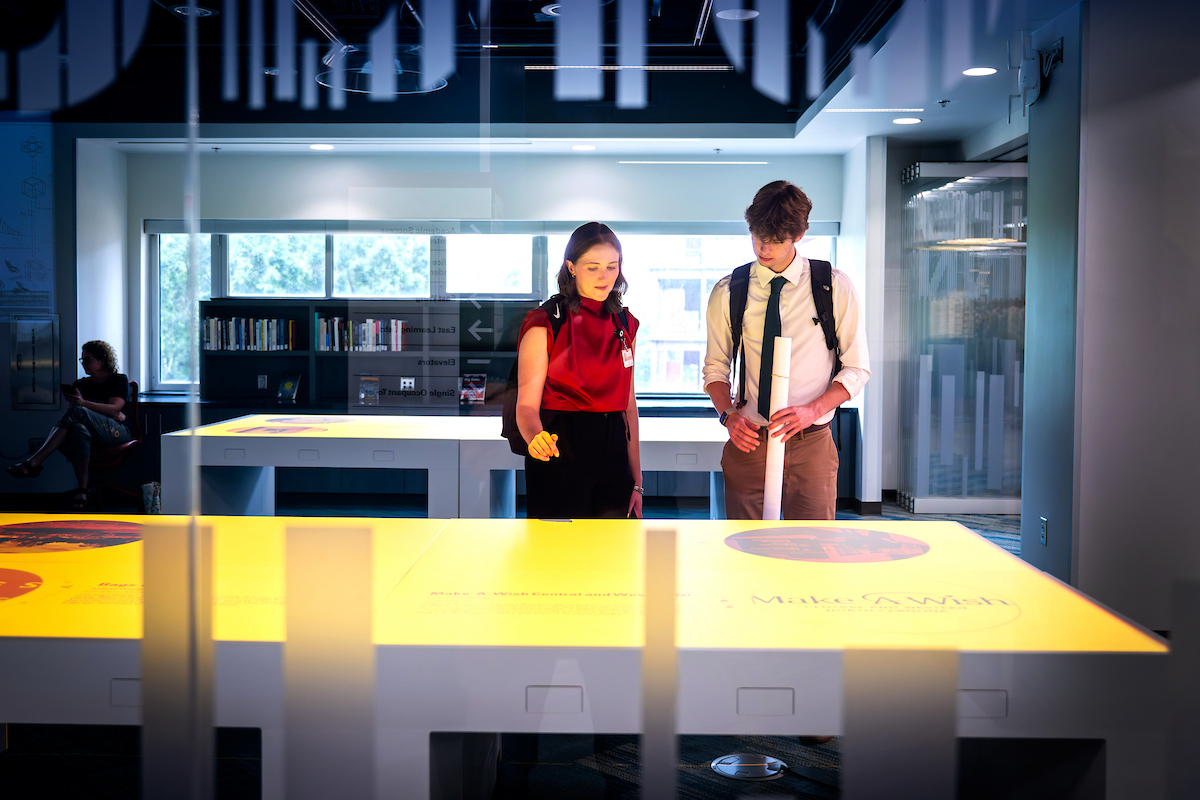 Students explore an exhibit in the iPearl Innovation Studio